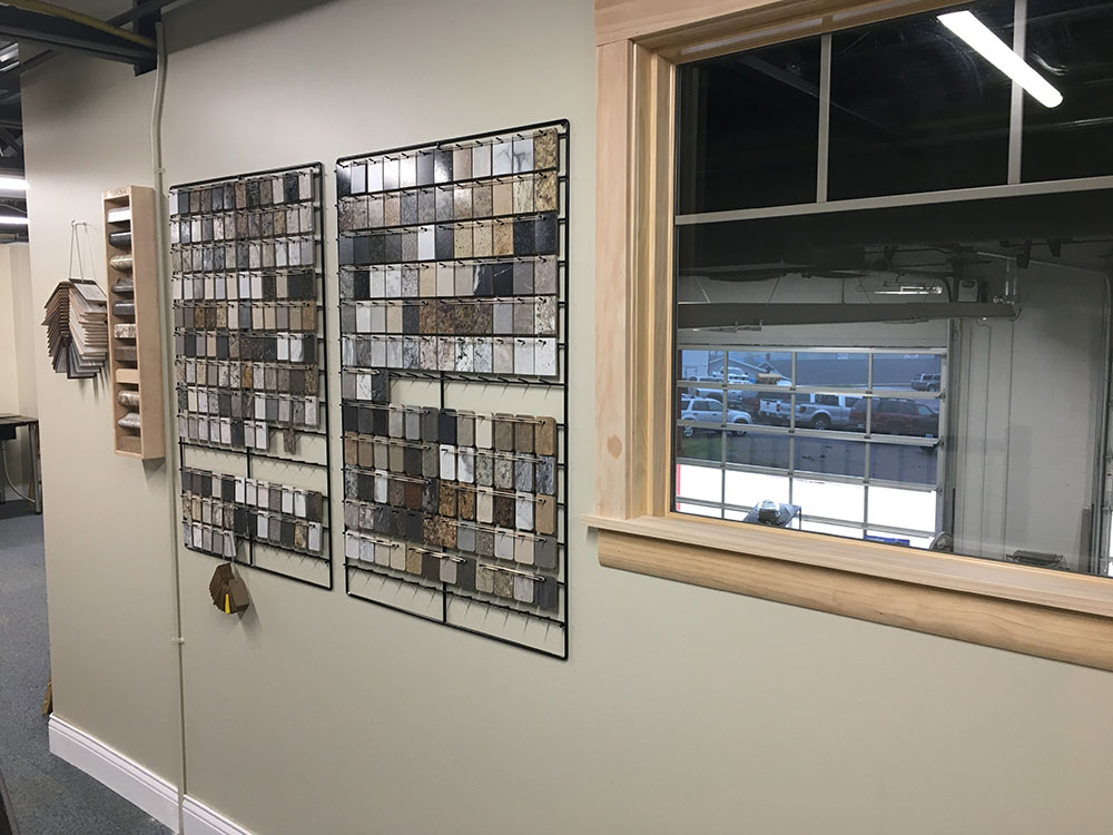 counter top color samples hanging next to a sample window